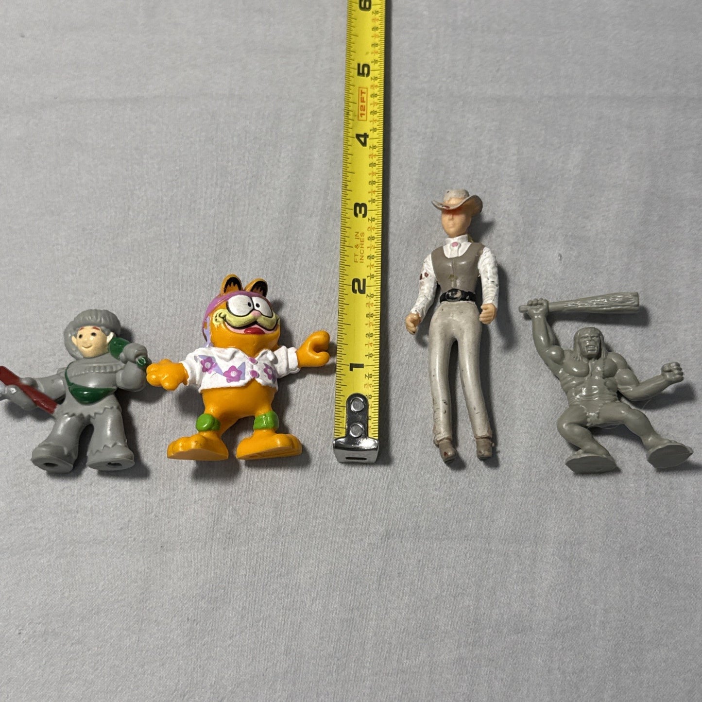 Lot of 7 Vintage Toy Figurines Pippy Longstockings Garfield Marx Caveman Bendale