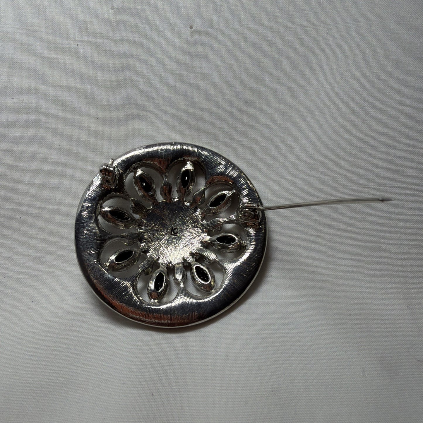 Vintage Brooch LC Black, Clear Gems Silver Tone Round Openwork 1980s Jewelry Pin