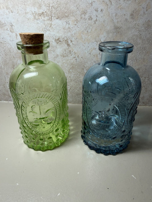Vintage Fleur de Lis Sunburst Glass Apothecary Bottles Green Blue Lot of Two VTG