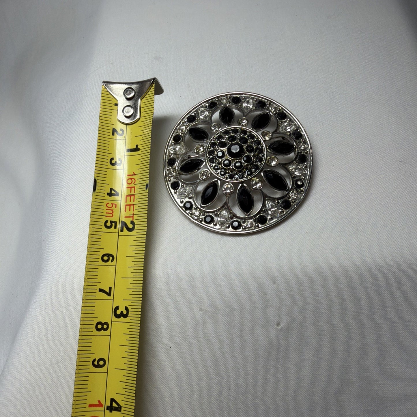 Vintage Brooch LC Black, Clear Gems Silver Tone Round Openwork 1980s Jewelry Pin